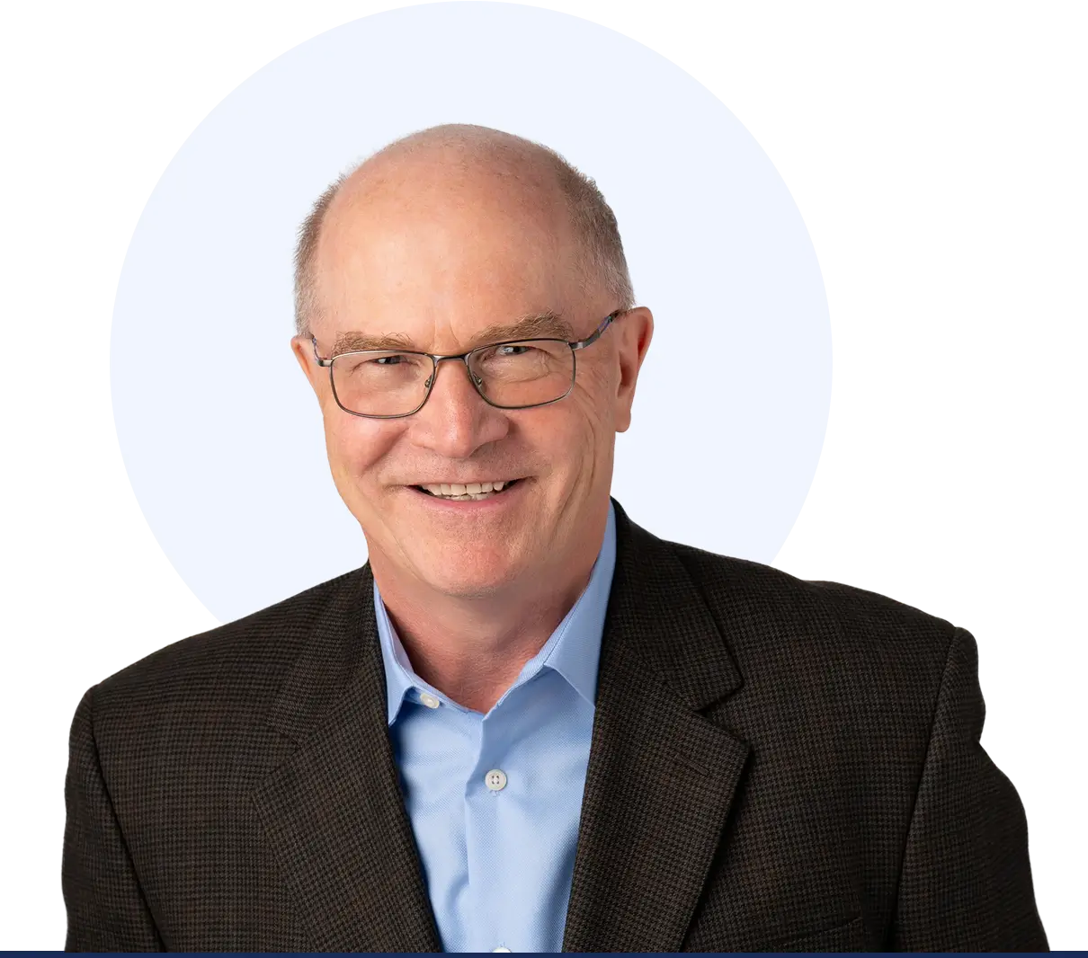 Smiling man in glasses and suit jacket.